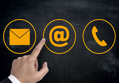Hand pointing to three icons for email, social media, and phone