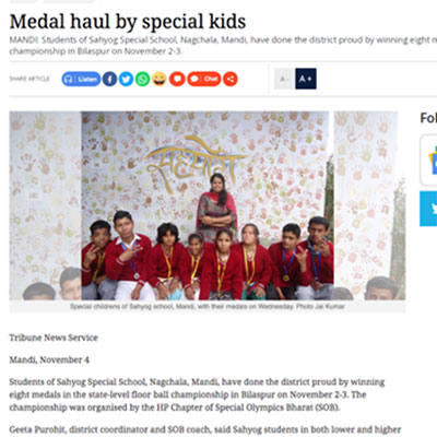 Press clipping about medal haul by special kids with picture of children sitting